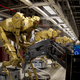 Illustration for article titled Robot Factories Are Where Shiny Gun Arms Are Made